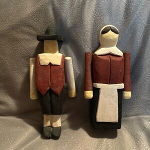 Pilgrim couple. Carved. Moveable arms. 10”